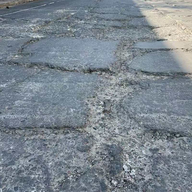 个旧路面起砂露石子修补料